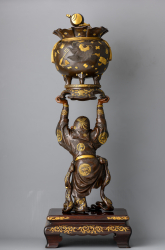 Скульптура божества Дайкоку с мешком богатства
